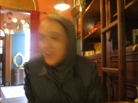 A blurred photo of judy in a shop doorway
